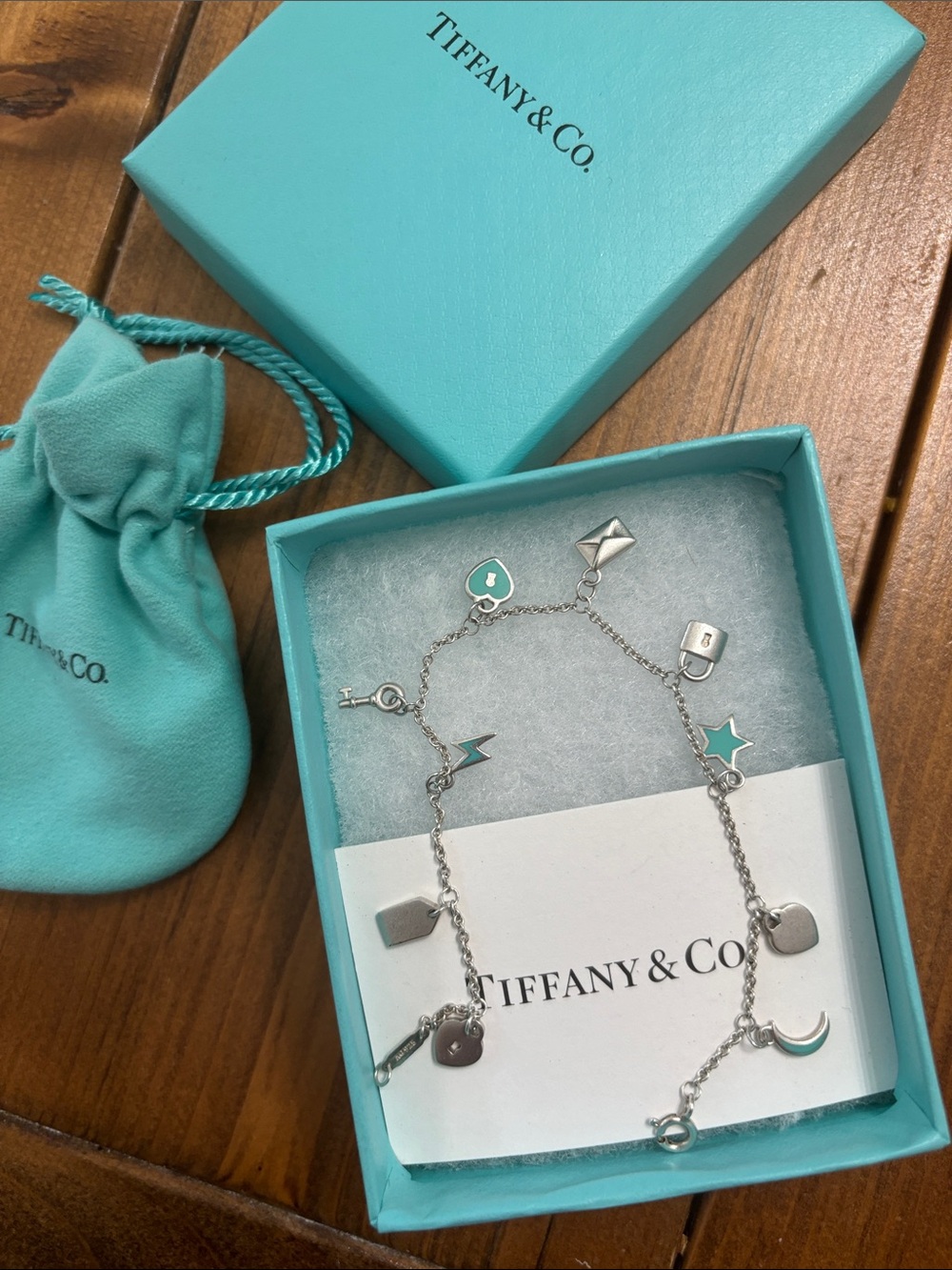 Tiffany & Co. Silver Charm Bracelet with Tiffany Blue Accents